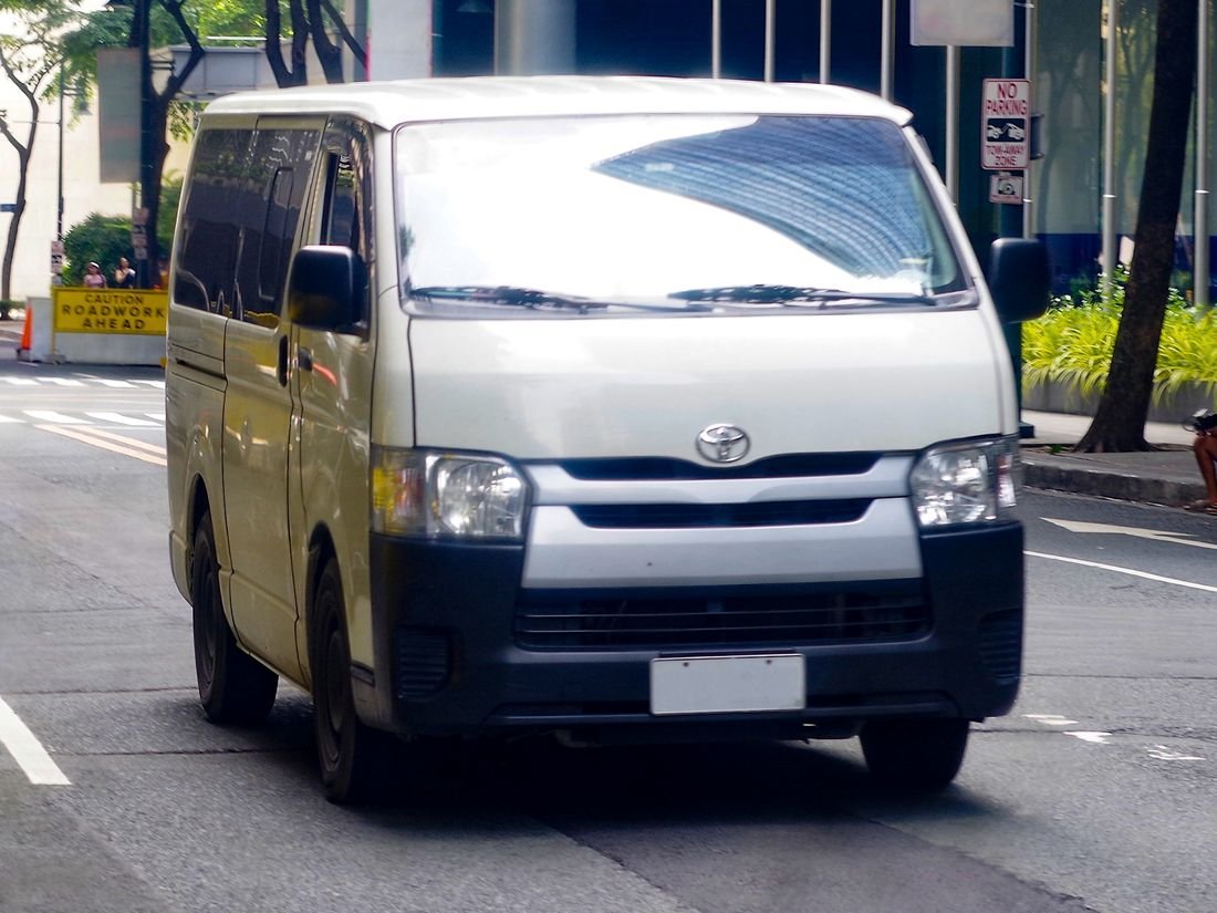 White Toyota HiAce passenger van