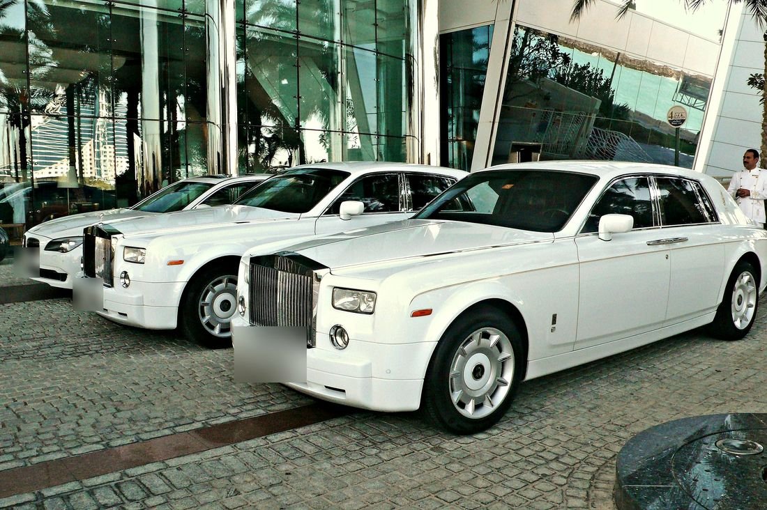 White Rolls-Royce Phantoms waiting outside a Dubai hotel